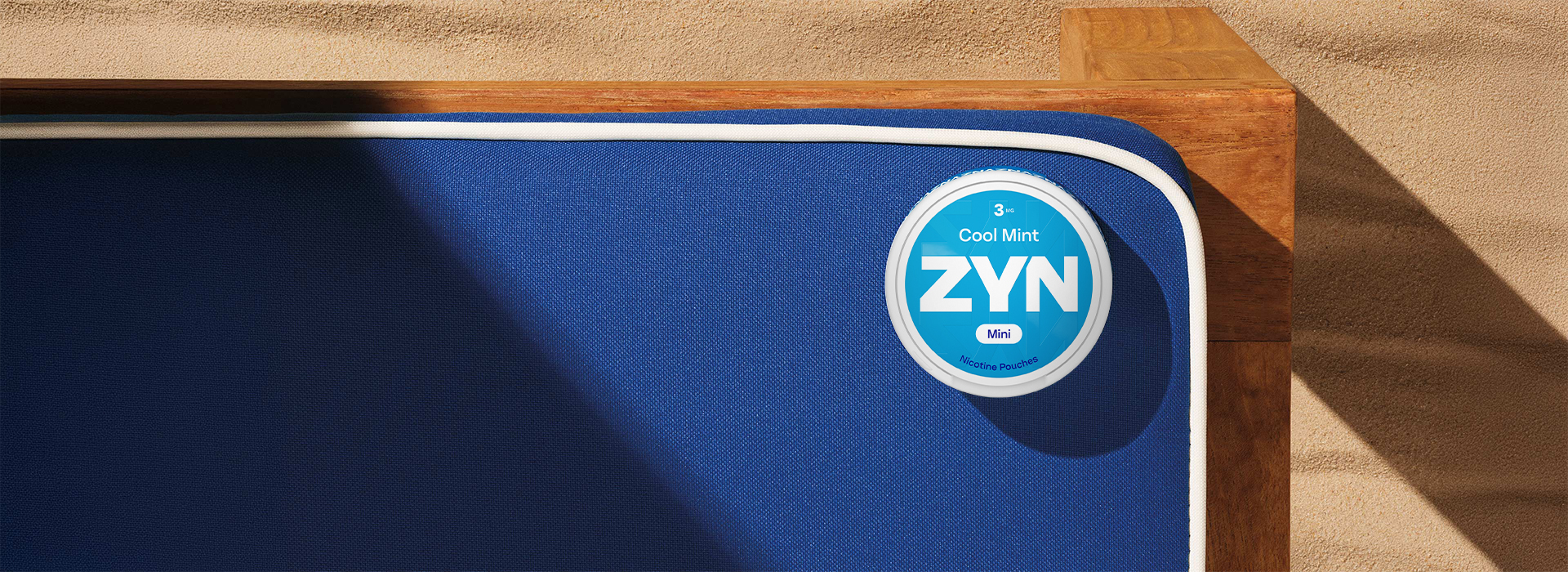 Blue ZYN Cool Mint can above a blue table